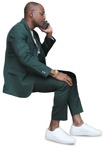Human png African businessman sitting talking on a phone  - miniature